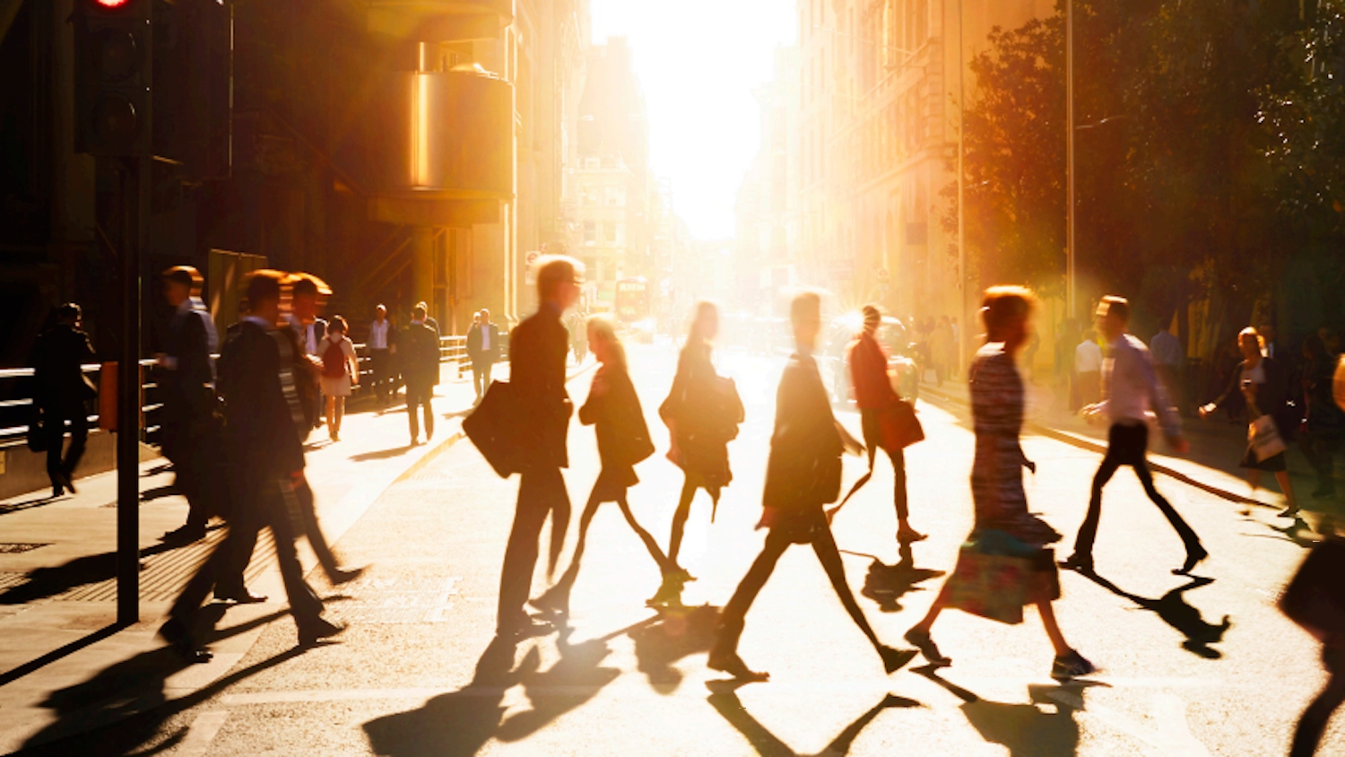 Many people crossing the street.
